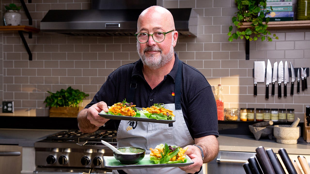 Chef Andrew Zimmern with Vietnamese Sweet Potato and Shrimp Fritters on plates